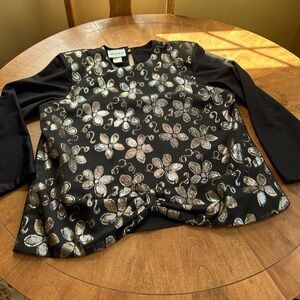 Woman’s dress top with irradescent front and scalloped front. New, never worn